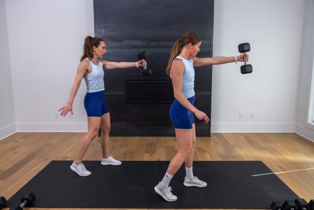 two women performing a dumbbell swing in a glutes and hamstrings workout